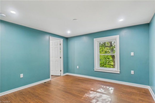 1924 E 25th St, Winston-Salem, NC 27105 - unfurnished room with baseboards, wood finished floors, and recessed lighting