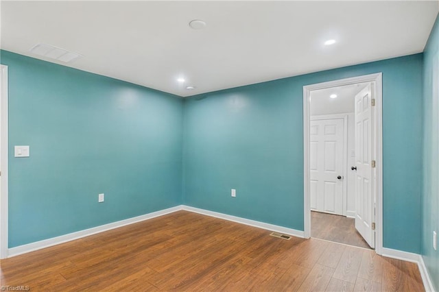 1924 E 25th St, Winston-Salem, NC 27105 - spare room featuring wood finished floors, baseboards, and recessed lighting