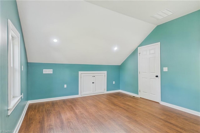 1924 E 25th St, Winston-Salem, NC 27105 - additional living space with vaulted ceiling, wood finished floors, and baseboards