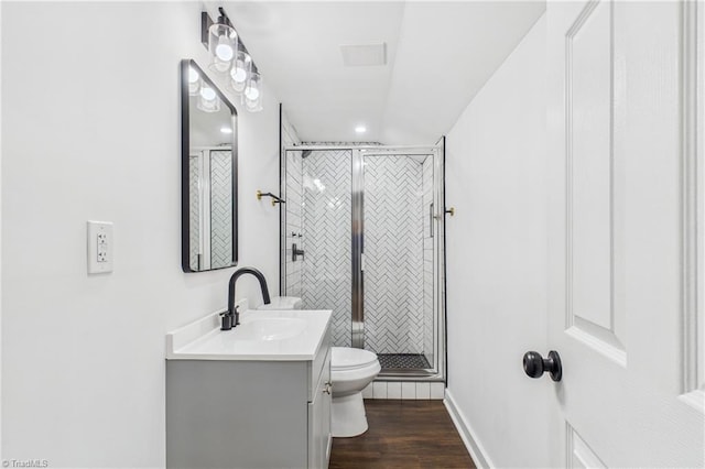 1924 E 25th St, Winston-Salem, NC 27105 - full bath with vanity, toilet, wood finished floors, a shower stall, and baseboards