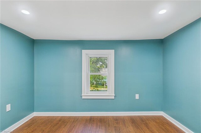 1924 E 25th St, Winston-Salem, NC 27105 - unfurnished room with baseboards, wood finished floors, and recessed lighting
