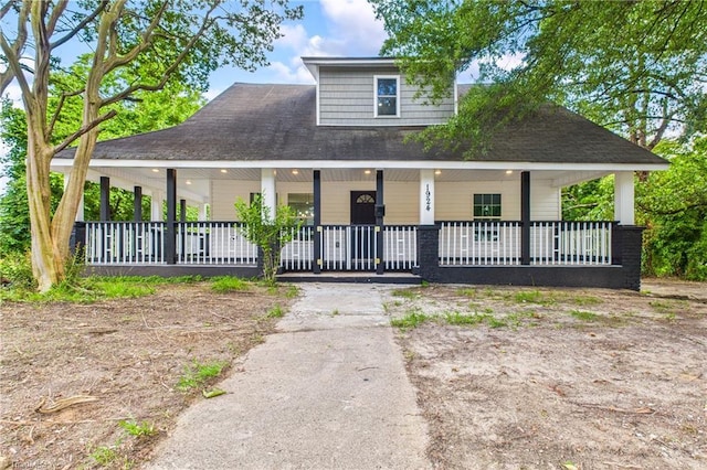 1924 E 25th St, Winston-Salem, NC 27105 - country-style home with covered porch, driveway, and a shingled roof