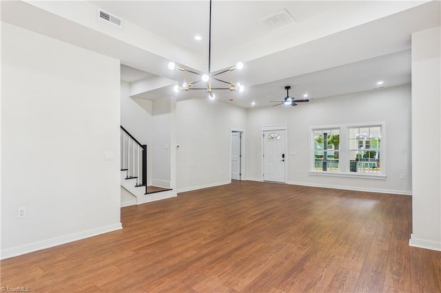 1924 E 25th St, Winston-Salem, NC 27105 - unfurnished living room with stairs, wood finished floors, a ceiling fan, recessed lighting, and baseboards
