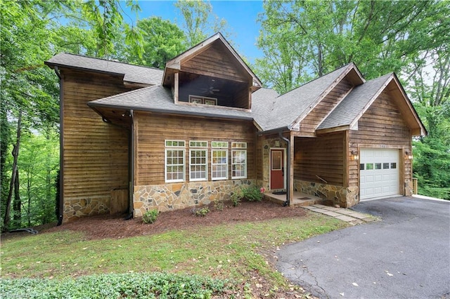 833 E Country Club Rd, Mount Airy, NC 27030 - view of front of house with an attached garage, stone siding, asphalt driveway, and a shingled roof