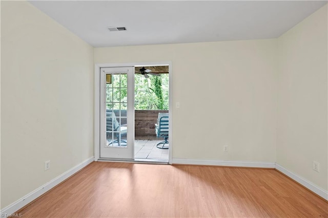 833 E Country Club Rd, Mount Airy, NC 27030 - empty room with wood finished floors, baseboards, and a ceiling fan