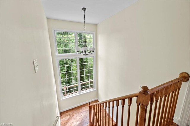 833 E Country Club Rd, Mount Airy, NC 27030 - stairs with a chandelier, healthy amount of natural light, baseboards, and wood finished floors