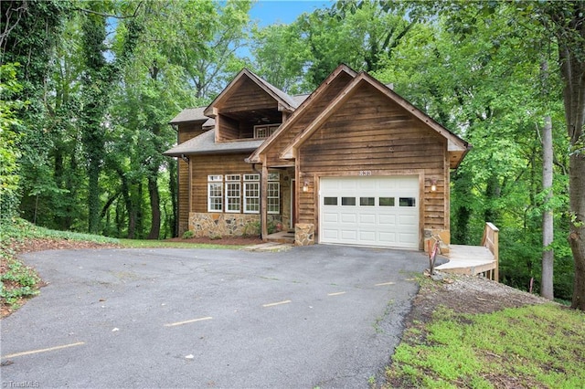 833 E Country Club Rd, Mount Airy, NC 27030 - view of front of property with stone siding, asphalt driveway, and an attached garage