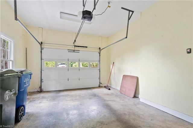 833 E Country Club Rd, Mount Airy, NC 27030 - garage featuring a garage door opener and baseboards