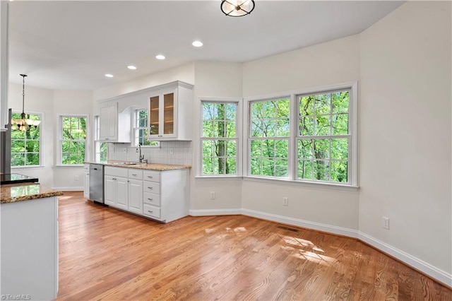 833 E Country Club Rd, Mount Airy, NC 27030 - kitchen with dishwasher, white cabinets, baseboards, light wood-style flooring, and recessed lighting