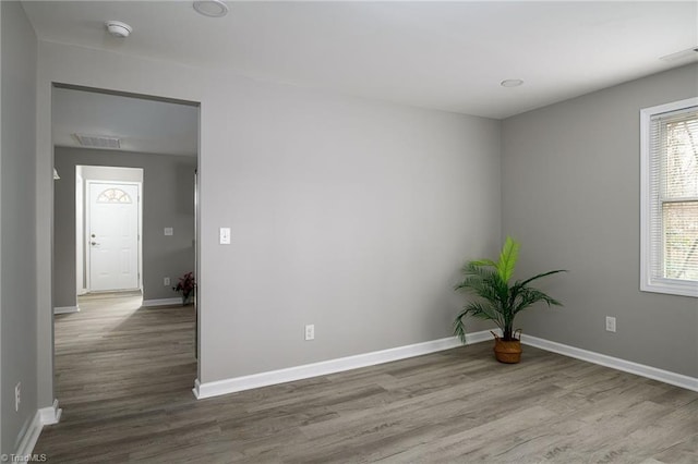 5425 Davis Rd, Walkertown, NC 27105 - empty room with a smoke detector and wood finished floors