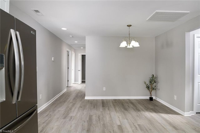 5425 Davis Rd, Walkertown, NC 27105 - unfurnished dining area featuring light wood finished floors, a chandelier, and recessed lighting
