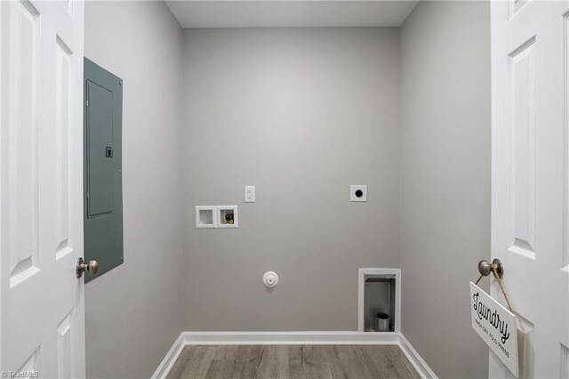 5425 Davis Rd, Walkertown, NC 27105 - laundry area featuring hookup for a washing machine, hookup for an electric dryer, wood finished floors, electric panel, and gas dryer hookup