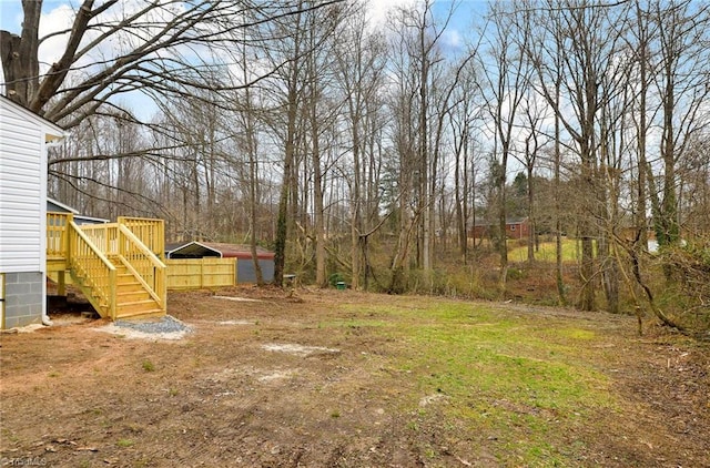 5425 Davis Rd, Walkertown, NC 27105 - view of yard with a carport, a wooden deck, and stairway