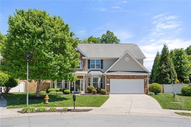 view of front facade with fence, concrete driveway, a front lawn, and a garage