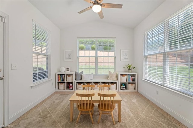 recreation room with baseboards, ceiling fan, lofted ceiling, and a wealth of natural light