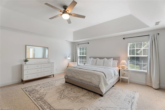 bedroom with multiple windows, carpet, and visible vents