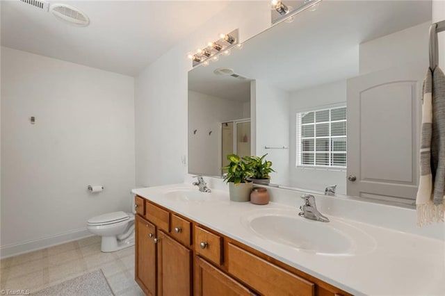 full bath featuring double vanity, a sink, tile patterned floors, and a shower stall