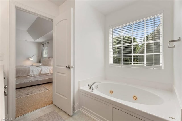 bathroom with a tub with jets and ensuite bath