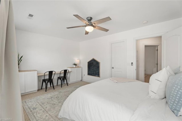 bedroom featuring baseboards, carpet, a ceiling fan, and visible vents