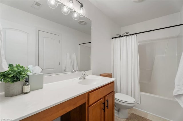 bathroom featuring vanity, tile patterned flooring, visible vents, toilet, and shower / bath combo