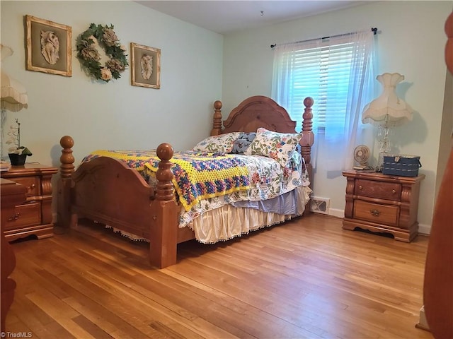 bedroom with hardwood / wood-style flooring