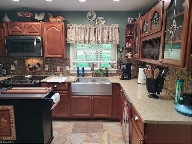 kitchen featuring decorative backsplash, electric range, and sink