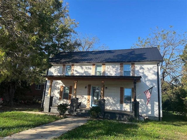 view of front of home with a front lawn and covered porch