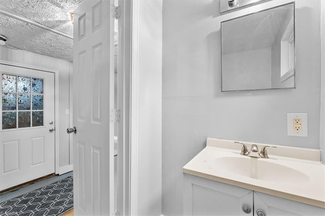 1655 Oakleigh Rd, Mcleansville, NC 27301 - bathroom with vanity and a textured ceiling