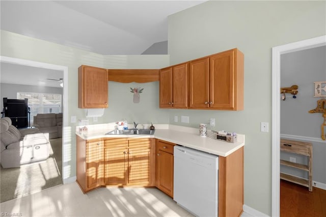 kitchen featuring white dishwasher, ceiling fan, lofted ceiling, and sink