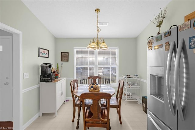 dining space featuring a chandelier