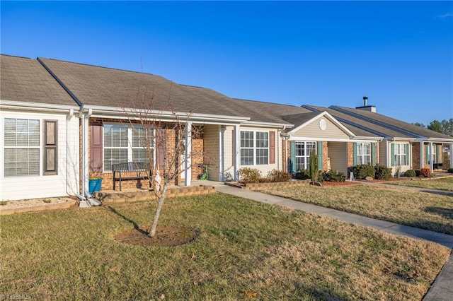 ranch-style house with a front lawn