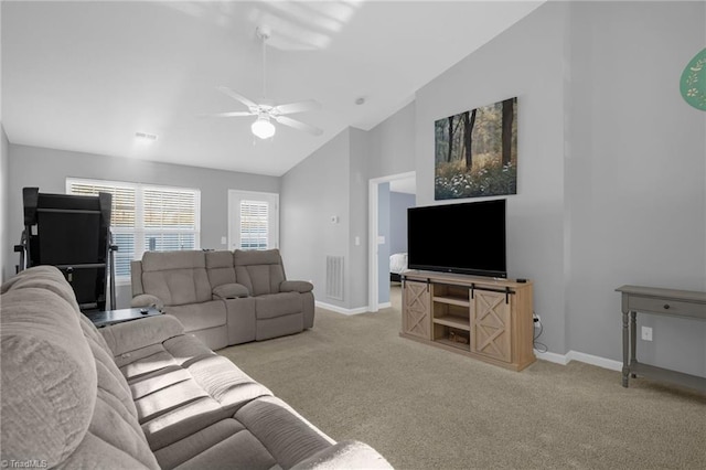 living room with ceiling fan, light colored carpet, and lofted ceiling