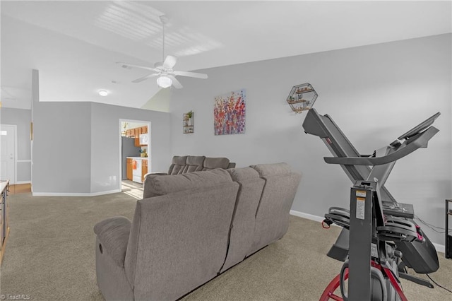 exercise area with ceiling fan, carpet floors, and lofted ceiling