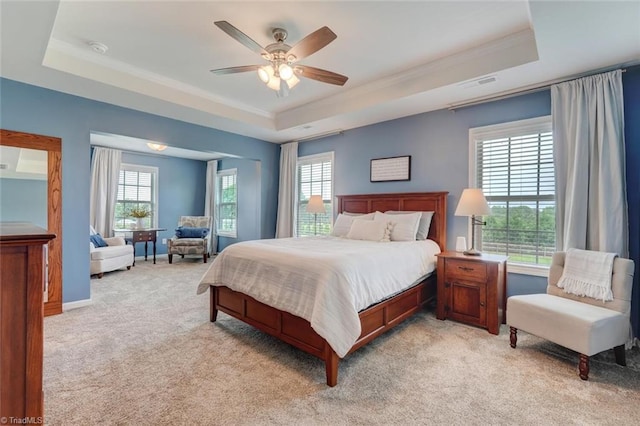 113 Crestbourne Ct, Stokesdale, NC 27357 - bedroom featuring a raised ceiling, light carpet, ornamental molding, and a ceiling fan