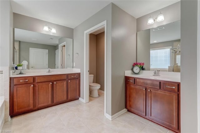 113 Crestbourne Ct, Stokesdale, NC 27357 - full bathroom featuring two vanities, tile patterned floors, and a bath