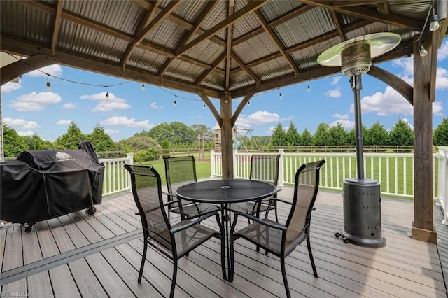 113 Crestbourne Ct, Stokesdale, NC 27357 - deck with outdoor dining area, a gazebo, a grill, and view of scattered trees