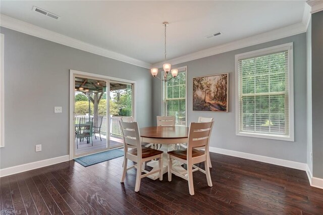 113 Crestbourne Ct, Stokesdale, NC 27357 - dining area with ornamental molding, dark wood-type flooring, and a chandelier