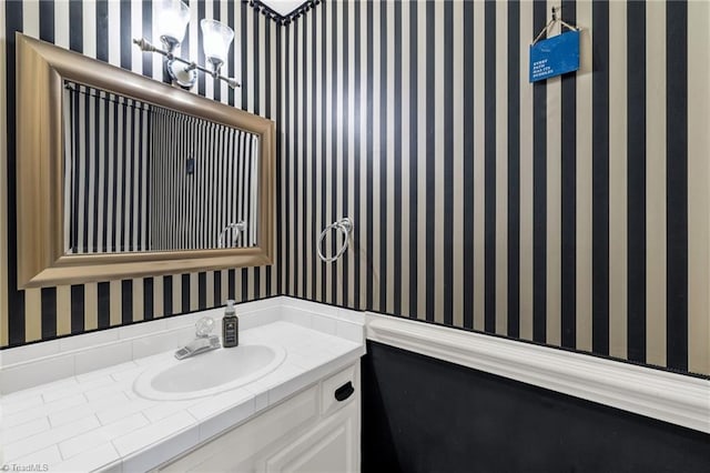 5660 W Market St Unit A, Greensboro, NC 27409 - bathroom featuring wallpapered walls and vanity