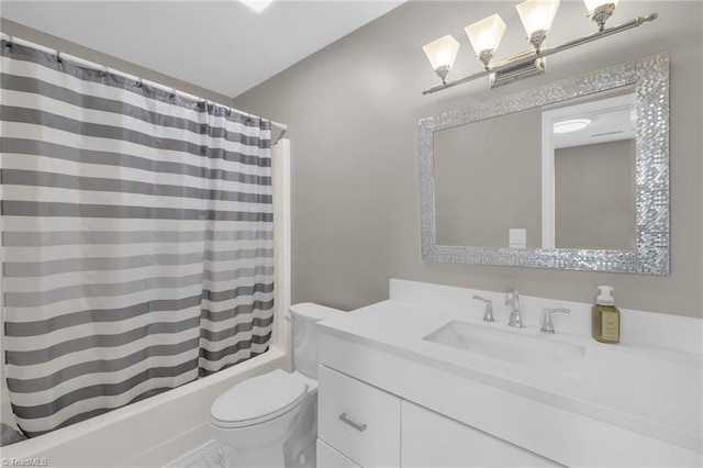 5660 W Market St Unit A, Greensboro, NC 27409 - full bath with vanity, toilet, shower / bath combo with shower curtain, and a chandelier