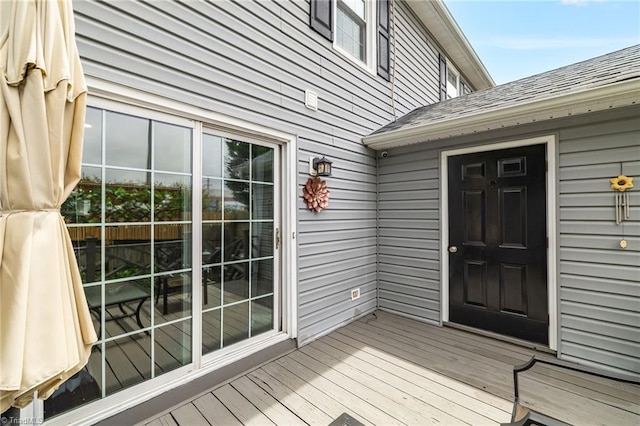5660 W Market St Unit A, Greensboro, NC 27409 - view of exterior entry with roof with shingles and a wooden deck