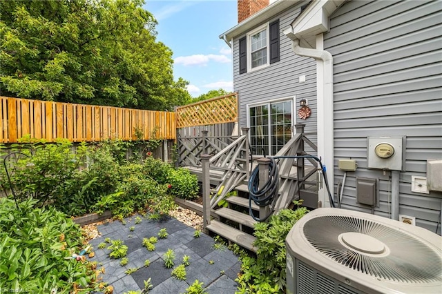 5660 W Market St Unit A, Greensboro, NC 27409 - fenced backyard featuring central air condition unit, a patio, and a deck