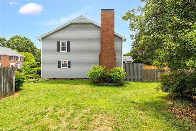 5660 W Market St Unit A, Greensboro, NC 27409 - rear view of house featuring a chimney and crawl space