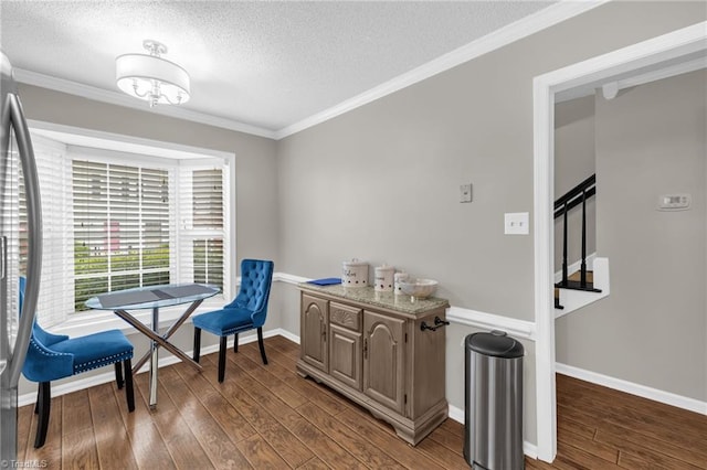 5660 W Market St Unit A, Greensboro, NC 27409 - sitting room featuring a textured ceiling, dark wood-style floors, ornamental molding, stairway, and baseboards