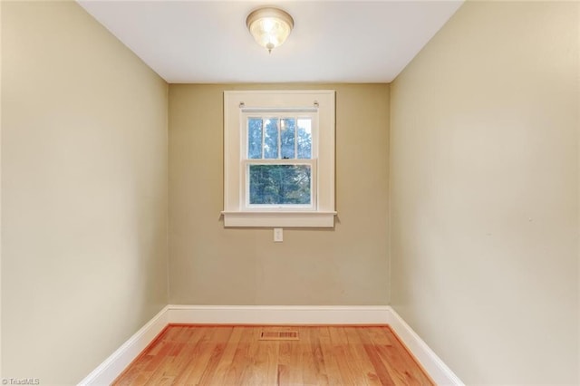 spare room featuring hardwood / wood-style floors