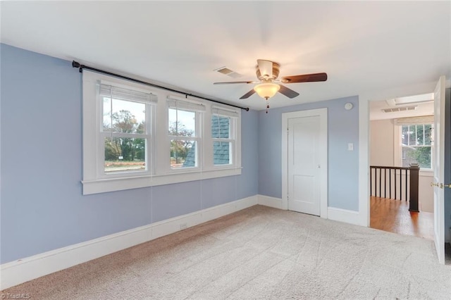 unfurnished bedroom with carpet and ceiling fan