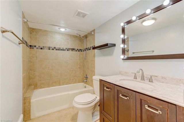 full bathroom with tile patterned flooring, vanity, toilet, and tiled shower / bath