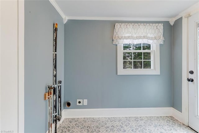 clothes washing area featuring hookup for an electric dryer and crown molding