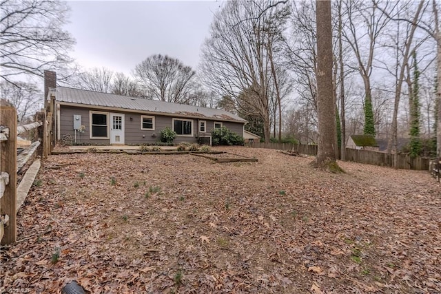 rear view of property featuring a patio