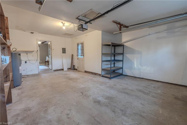 garage featuring a garage door opener and water heater