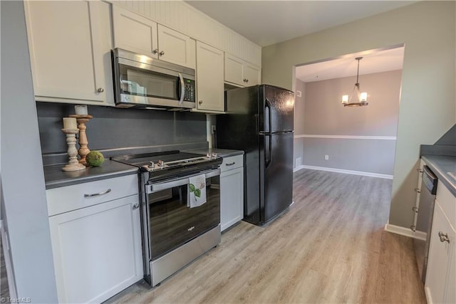 kitchen featuring white cabinetry, appliances with stainless steel finishes, and light hardwood / wood-style flooring